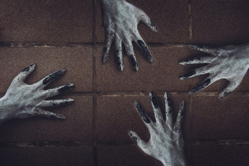 Ghost hand on the wall horror scene of woman death movie halloween festival in the dark house...