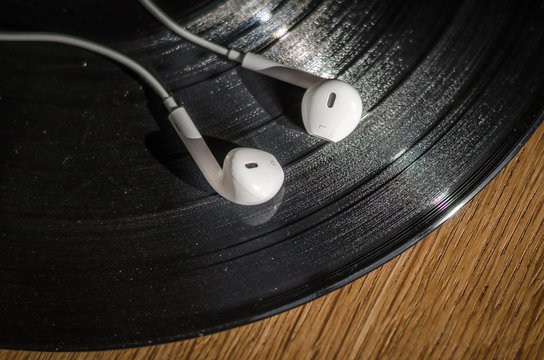 Earplugs or earphones on a vinyl record