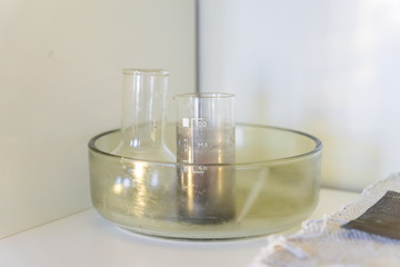 School laboratory stuff on a shelf - tube and flask. study of natural sciences