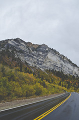 The road running along the granite peaks of the utah mountains. 