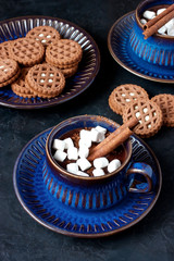  Mug with hot chocolate and tasty cookies