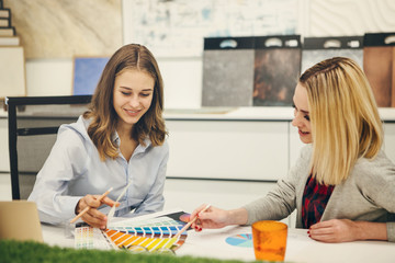 Fototapeta premium Women in the design studio discussing goals .