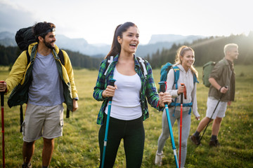 Hiking with friends is so fun. Group of young people with backpacks walking together