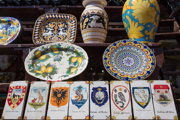 Siena Italy July 1st 2015 : Ceramic vases and tiles featuring some of the districts represented in the famous palio horse race