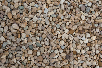 Stone pebbles brown and gray gravel texture background for decoration.
