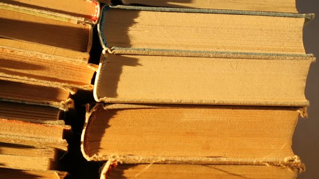 Heap of old books in sunlight