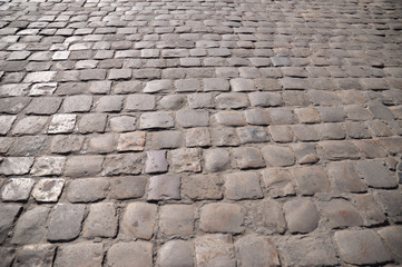 Old street pavers. Path paving surface.