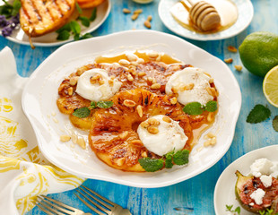 Pineapple dessert, Grilled slices of pineapple with the addition of cream cheese, honey, roasted...