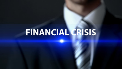 Financial crisis, businessman in suit standing in front of screen money problems