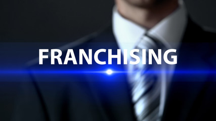 Franchising, businessman in official suit standing in front of screen, branding