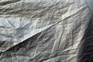 Crumpled plastic textile texture.