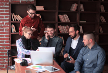 creative group of designers at a working meeting in the Studio.