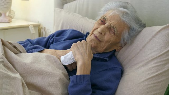 Elderly caucasian woman with heart attack, chest pain. (senior adult 80+)