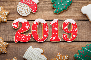 2019, New Year gingerbread, red icing, isolated on wooden background