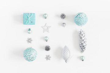 Christmas composition. Christmas gifts, blue decorations on white background. Flat lay, top view, copy space