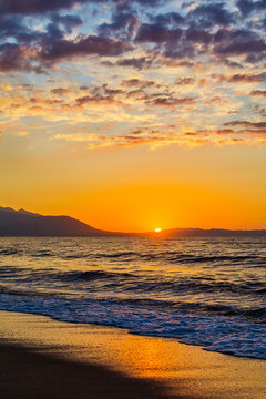 Early morning , dramatic sunrise over sea and mountain. Photographed in Asprovalta, Greece.