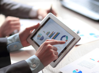 close up.a businessman works with marketing data