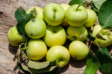 Fresh ripe apples on rustic wooden table
