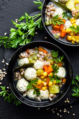 Delicious vegetable soup with chicken meatballs and pearl barley