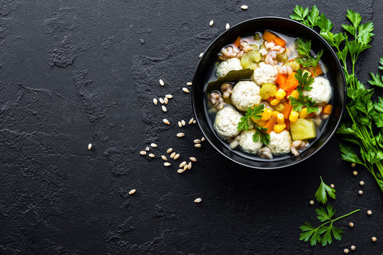 Delicious vegetable soup with chicken meatballs and pearl barley