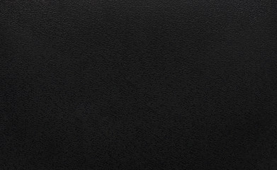 Black plastic texture background. Dark rough material in pvc object.
