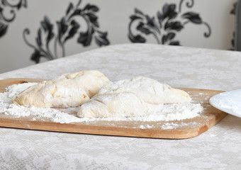 raw pie on wooden board on the table