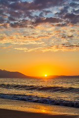 Naklejka premium Early morning , dramatic sunrise over sea and mountain. Photographed in Asprovalta, Greece.