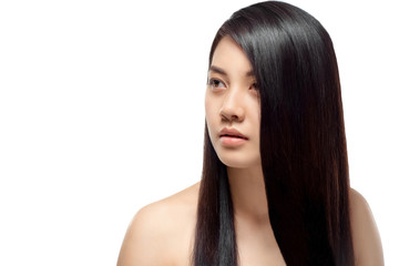 Naklejka premium portrait of young asian woman with beautiful and healthy hair looking away isolated on white