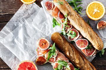 Sandwich prosciutto mascarpone cheese figs wine top view copy space