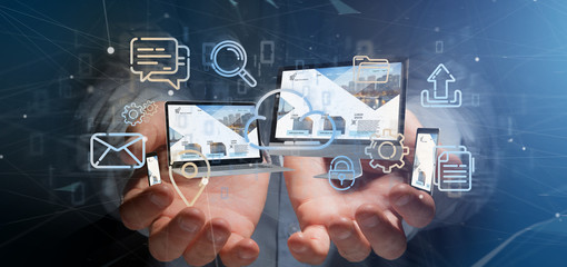 Businessman holding a Devices connected to a cloud multimedia network 3d rendering