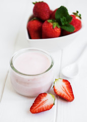 Jar with strawberry yogurt