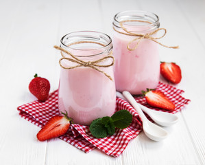 Jars with strawberry yogurt