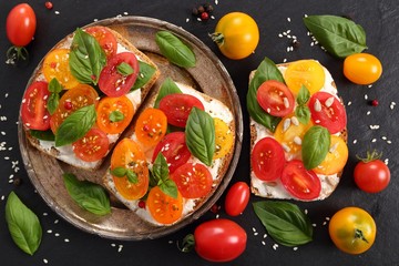 Sandwiches with cheese and tomatoes.