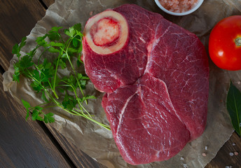 raw beef on a wooden surface