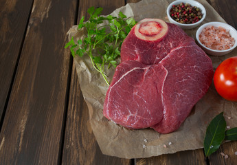 raw beef on a wooden surface
