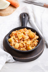 Cabbage stewed with potatoes. Vegetable ragout. Vegan and vegetarian cuisine.