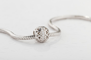 Silver charm bead with diamonds for chain bracelet - obrazy, fototapety, plakaty