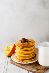 Stack of pancakes with pecan and syrup