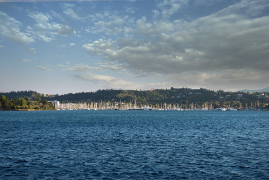 Crowded touristic harbor with lots of sailing boats