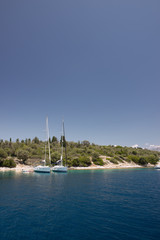 Fototapeta na wymiar Sail boats docked by the coastline