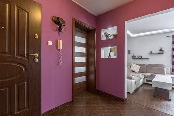 Purple hall interior in the apartment