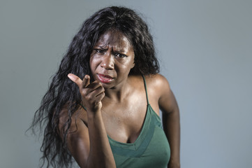 young beautiful and stressed black African American woman feeling upset and angry gesturing...
