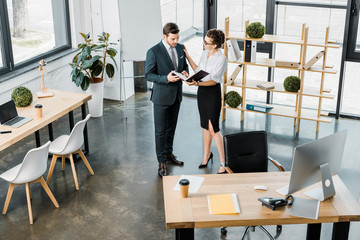 high angle view of young business colleagues in office
