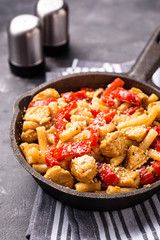 Pasta with chicken and pepper in tomato sauce