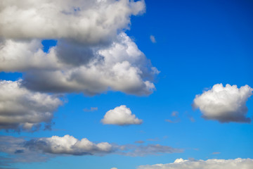 Blue sky background with fluffy clouds