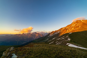 Obraz premium Scenic view of beautiful landscape of Swiss Alps in a Val De Bagnes area. Dramatic sunset scene in high mountains.