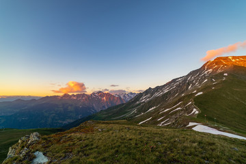 Obraz premium Scenic view of beautiful landscape of Swiss Alps in a Val De Bagnes area. Dramatic sunset scene in high mountains.