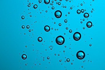 fresh drops background blue glass / wet rainy background, water drops transparent glass blue