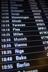 Fototapeta premium board airport departures schedule / departure of city airplanes flights font at the airport