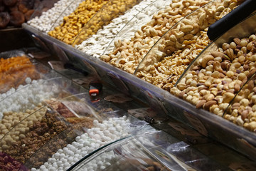 Stand with different kinds of nuts and dried fruits for tea in a bazaar in Istanbul.